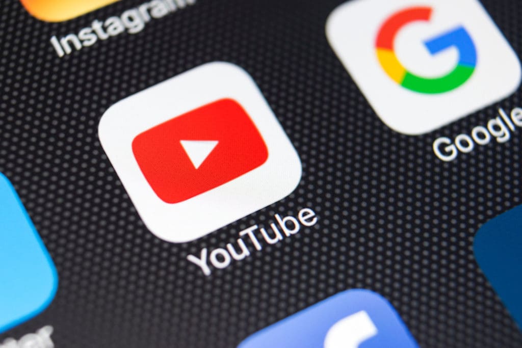 Image accompanying "How Does YouTube Recommend Videos (and Why it’s Not Recommending Yours)" - The YouTube app icon displayed as an app shortcut on a smartphone. 